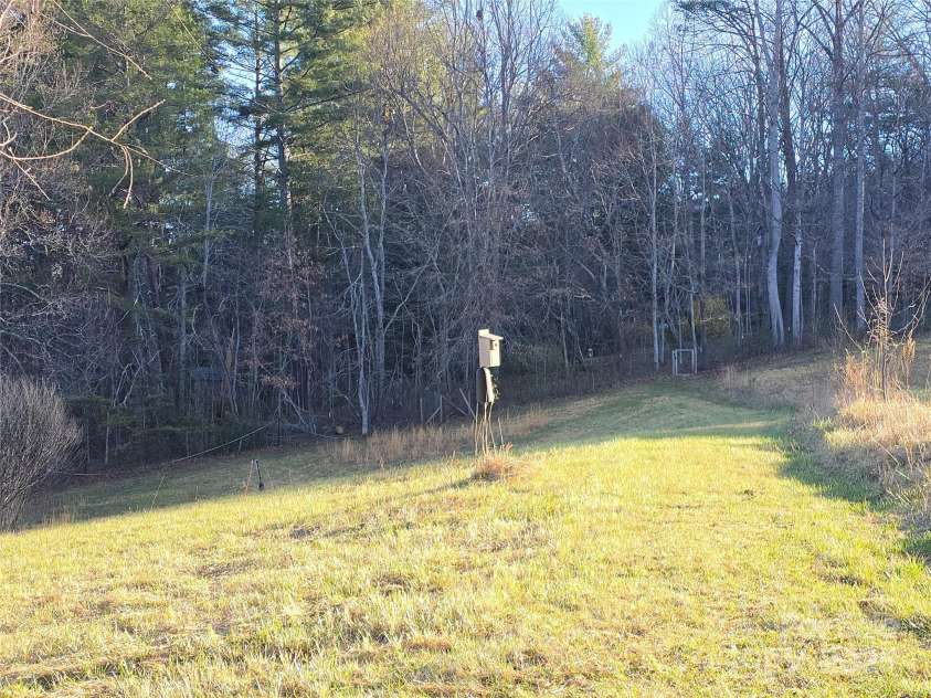 14 Woods Drive, Fairview, NC 28730.  MLS# CAR4223729, YatesRealty ID 9429. Open green area.