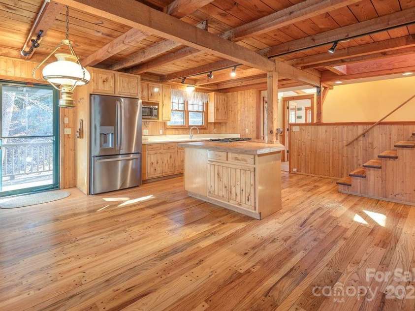 14 Woods Drive, Fairview, NC 28730.  MLS# CAR4223729, YatesRealty ID 9429. Post and Beam, open kitchen and dining area with back deck access.