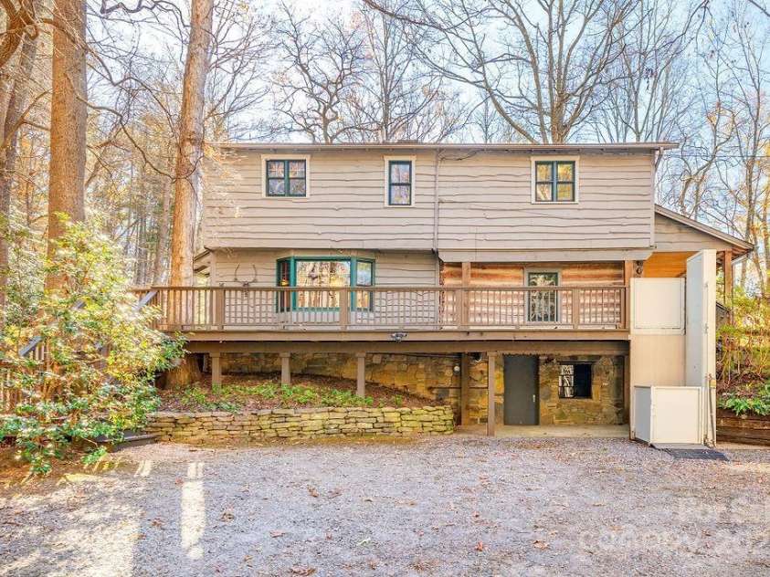 14 Woods Drive, Fairview, NC 28730.  MLS# CAR4223729, YatesRealty ID 9429. Side of the home with a lift.
