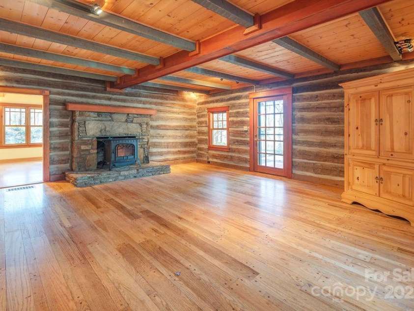 14 Woods Drive, Fairview, NC 28730.  MLS# CAR4223729, YatesRealty ID 9429. This log cabin was originally built in the 1,800's and moved here in 1976. It's wormy chestnut logs.