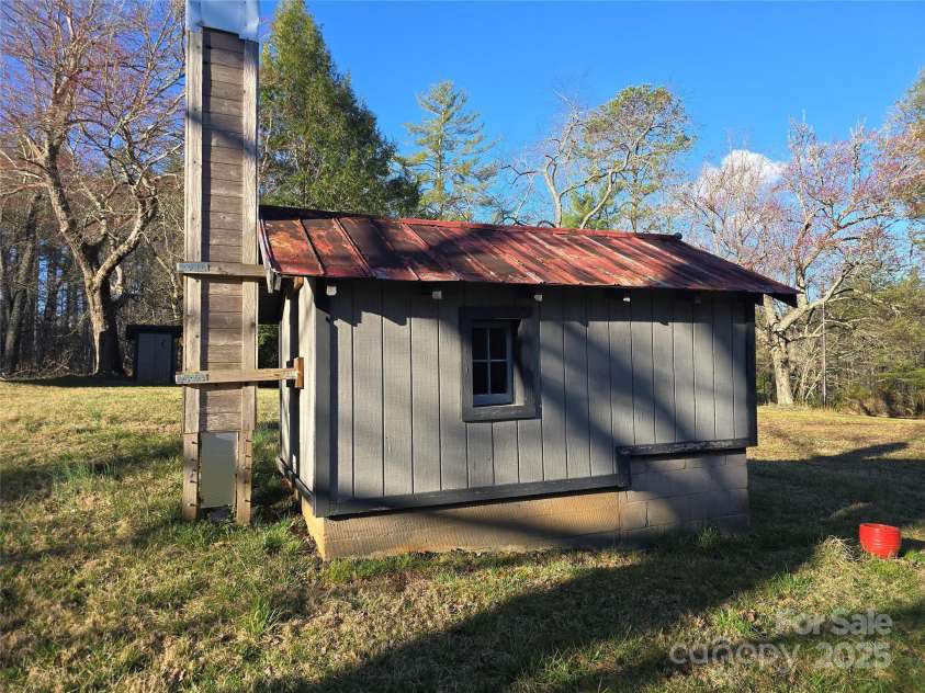 14 Woods Drive, Fairview, NC 28730.  MLS# CAR4223729, YatesRealty ID 9429. Well house with manmade chimney swift breeding tower.