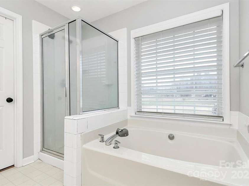 13930 Thompson Road, Mint Hill, NC 28227.  MLS# CAR4232269, YatesRealty ID 9430. Relaxing soaker's tub