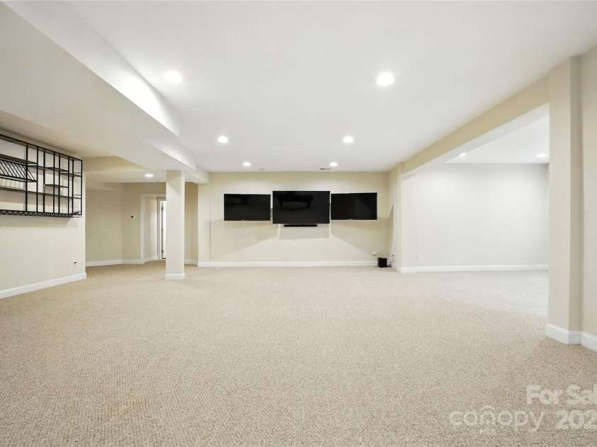 208 Woodwinds Drive, Mount Holly, NC 28120.  MLS# CAR4288550, YatesRealty ID 9433. Large finished Basement