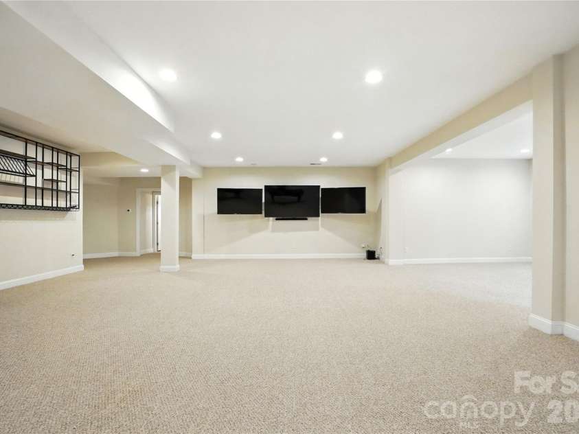 208 Woodwinds Drive, Mount Holly, NC 28120.  MLS# CAR4288550, YatesRealty ID 9433. Large finished Basement