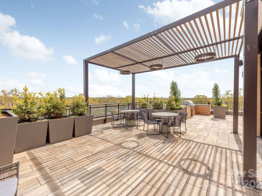 130 Cherokee Road, Charlotte, NC 28207.  MLS# CAR4125044, YatesRealty ID 944. Roof top dinning area with gas grill.