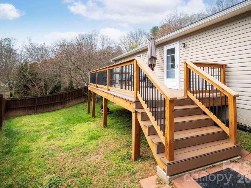 60 Huffman Road, Asheville, NC 28806.  MLS# CAR4361806, YatesRealty ID 9442. Backyard With Large Deck