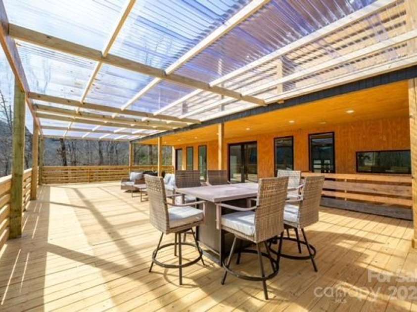 174 Crooked Creek Estates, Old Fort, NC 28762.  MLS# CAR4247439, YatesRealty ID 9447. Another look at the outdoor entertainment area. Just imagine enjoying your morning coffee here!