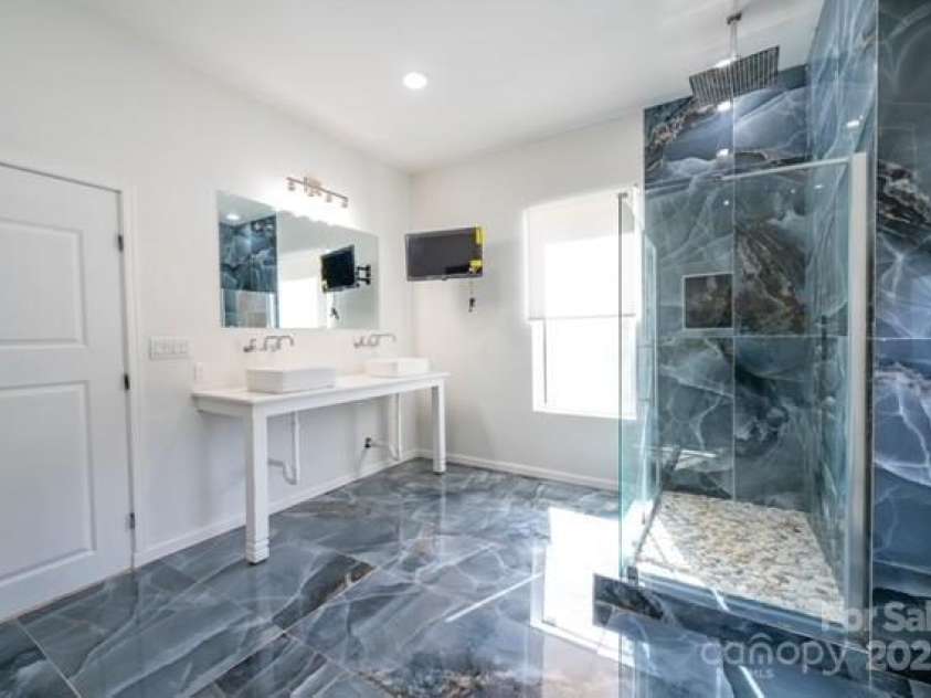 174 Crooked Creek Estates, Old Fort, NC 28762.  MLS# CAR4247439, YatesRealty ID 9447. Another look at the primary bathroom. Note the twin vanities.