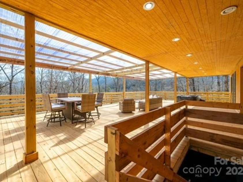 174 Crooked Creek Estates, Old Fort, NC 28762.  MLS# CAR4247439, YatesRealty ID 9447. Gorgeous mountain views meet spacious entertaining area. This is one of two decks at the house. This one is nearly 1,400 sq ft.