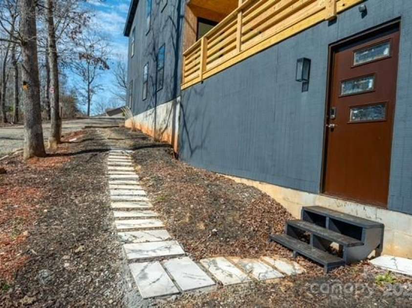174 Crooked Creek Estates, Old Fort, NC 28762.  MLS# CAR4247439, YatesRealty ID 9447. Outside entrance to the three-car garage.
