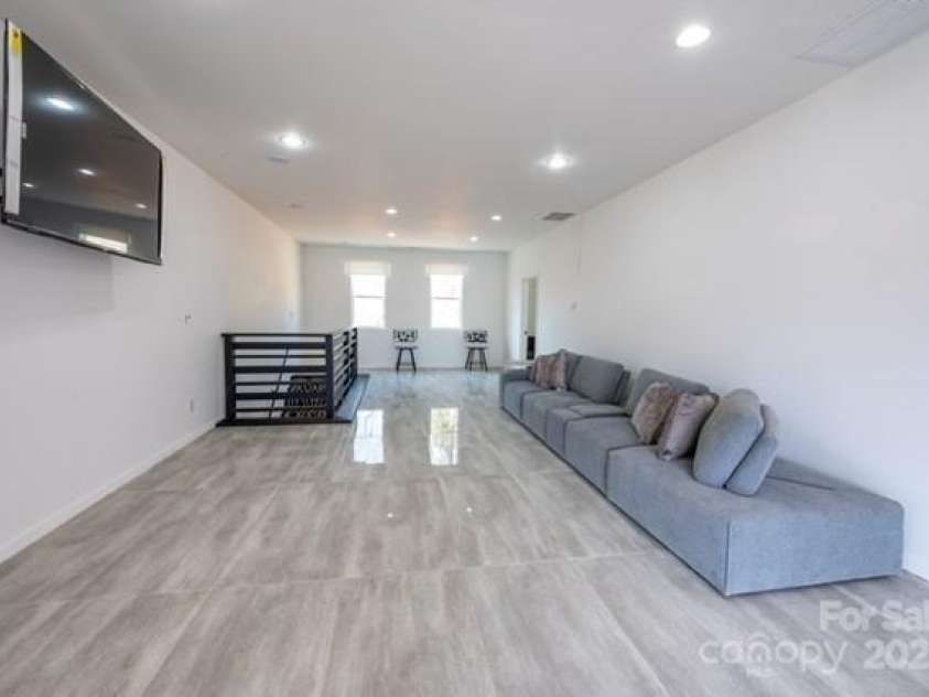 174 Crooked Creek Estates, Old Fort, NC 28762.  MLS# CAR4247439, YatesRealty ID 9447. Second floor living area boasts lots of natural light and also mountain views!