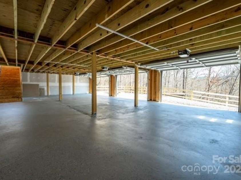 174 Crooked Creek Estates, Old Fort, NC 28762.  MLS# CAR4247439, YatesRealty ID 9447. Spacious three-car garage for all of your toys.