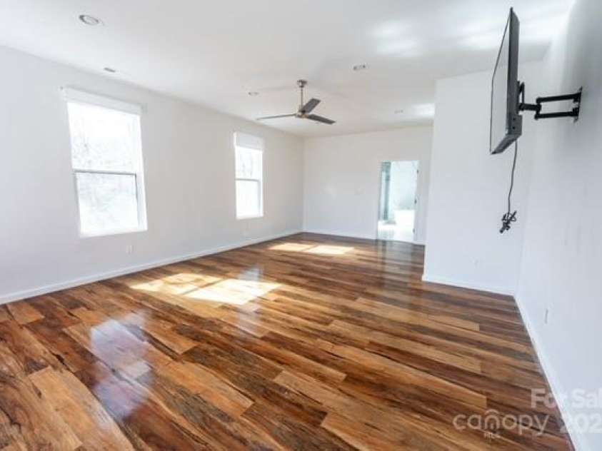 174 Crooked Creek Estates, Old Fort, NC 28762.  MLS# CAR4247439, YatesRealty ID 9447. This light-filled secondary bedroom upstairs boasts mountain views and an ensuite bathroom. Upstairs is about 1,895 of HLA.