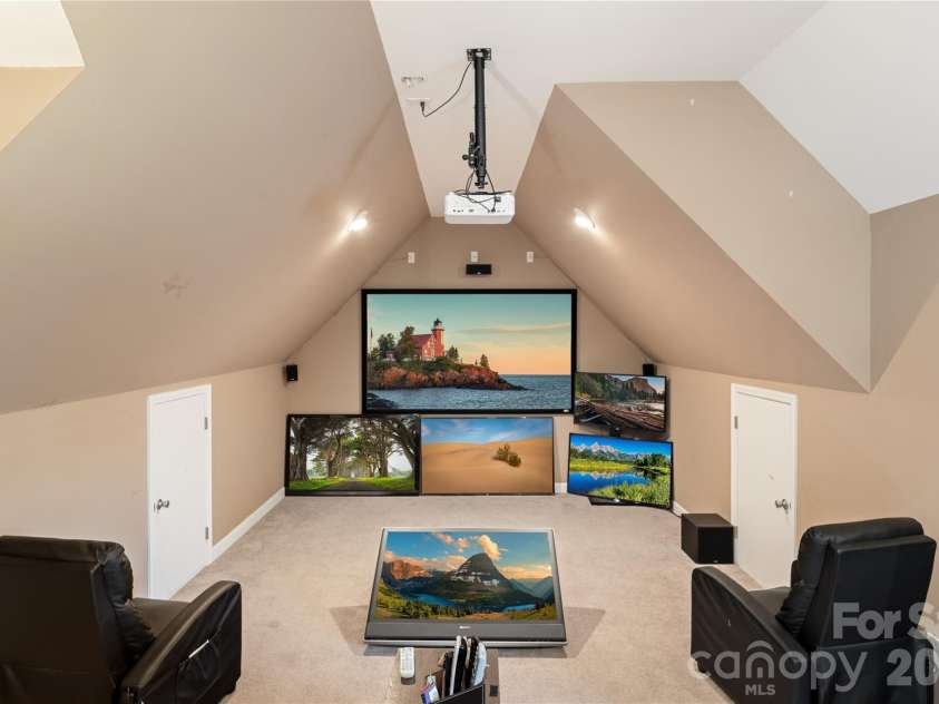 111 Lake Road, Stanley, NC 28164.  MLS# CAR4329636, YatesRealty ID 9448. Man cave, with projector screen attached 