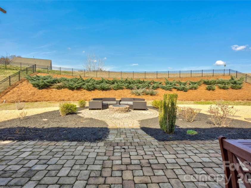 2186 Stone Pile Drive, Concord, NC 28025.  MLS# CAR4360856, YatesRealty ID 9453. Fire Pit Gathering