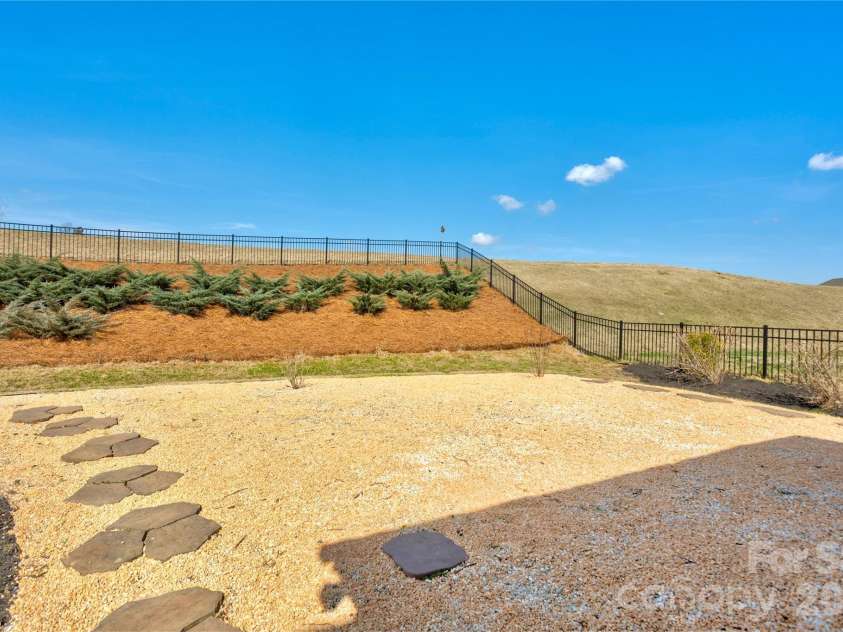 2186 Stone Pile Drive, Concord, NC 28025.  MLS# CAR4360856, YatesRealty ID 9453. Low/No Maintenance Yard