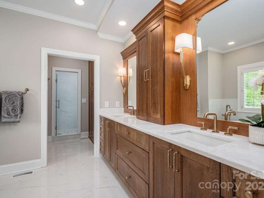 7701 Gold Hill Road, Rockwell, NC 28138.  MLS# CAR4246769, YatesRealty ID 9456. AMAZING primary bathroom! The cabinetry and accents are so nice!