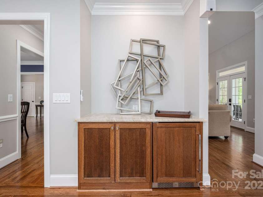 7701 Gold Hill Road, Rockwell, NC 28138.  MLS# CAR4246769, YatesRealty ID 9456. Built-in bar/entertainment area off kitchen and family room.