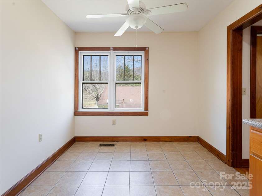 170 Pleasant Valley Road, Burnsville, NC 28714.  MLS# CAR4121722, YatesRealty ID 9462. Eat in kitchen space with double window
