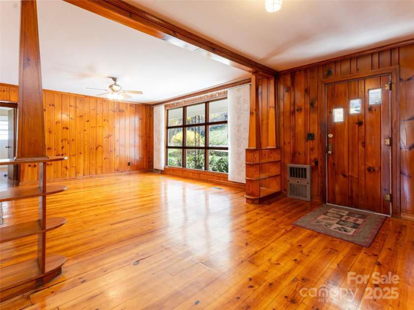 170 Pleasant Valley Road, Burnsville, NC 28714.  MLS# CAR4121722, YatesRealty ID 9462. Sunfilled living room