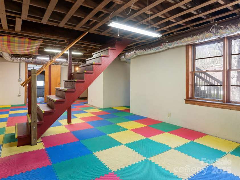 170 Pleasant Valley Road, Burnsville, NC 28714.  MLS# CAR4121722, YatesRealty ID 9462. Unfinished basement