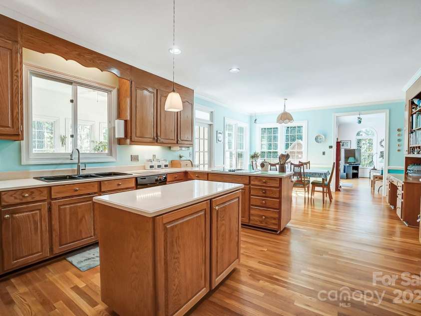 3717 Bodenham Court, Charlotte, NC 28215.  MLS# CAR4240203, YatesRealty ID 9464. Kitchen Island and view of dining and great room