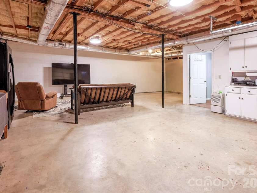 601 Azalea Lane, China Grove, NC 28023.  MLS# CAR4353505, YatesRealty ID 9473. Open basement room 