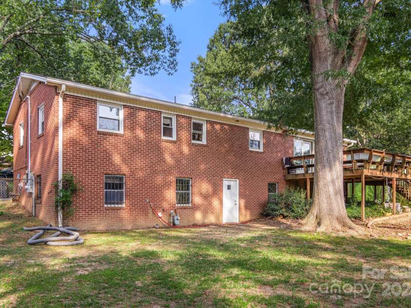 1573 Timberlake Drive, Shelby, NC 28150.  MLS# CAR4173911, YatesRealty ID 9474. There is an exit from the basement to the back yard, as well as sliding glass doors from the main floor.