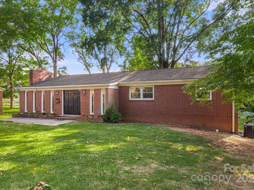 1573 Timberlake Drive, Shelby, NC 28150.  MLS# CAR4173911, YatesRealty ID 9474. This home is nestled in a peaceful setting, surrounded by trees.