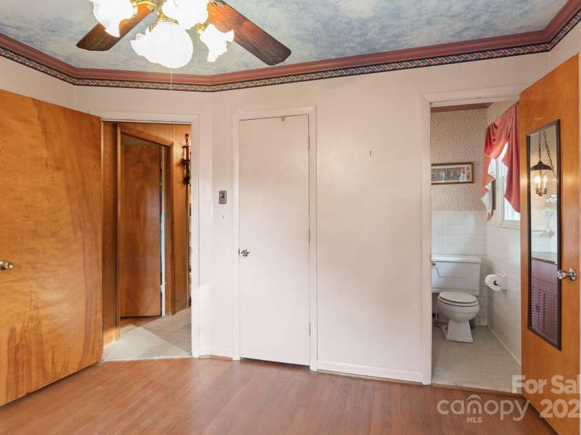 1573 Timberlake Drive, Shelby, NC 28150.  MLS# CAR4173911, YatesRealty ID 9474. View to hallway and half bath from bedroom