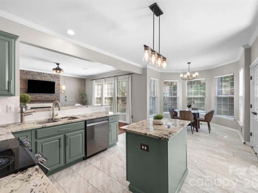 12141 Stone Forest Drive, Pineville, NC 28134.  MLS# CAR4360442, YatesRealty ID 9475. View from kitchen to den and breakfast room