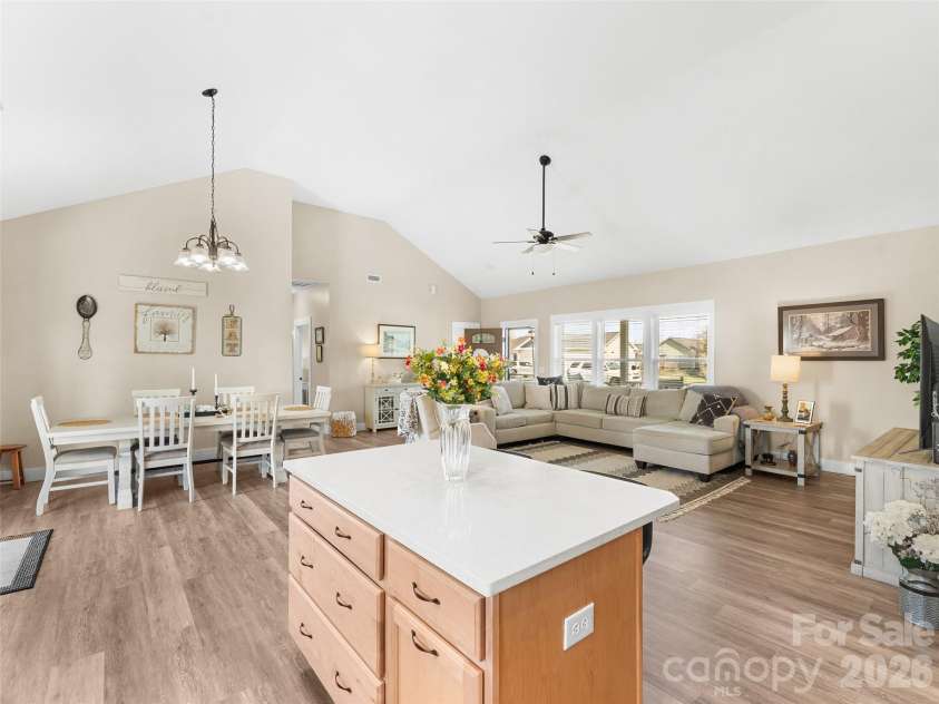 432 Sassafras Drive, Hendersonville, NC 28739.  MLS# CAR4366185, YatesRealty ID 9484. Kitchen & Dining Overview – Open kitchen and dining combination featuring ample cabinetry, a central island with seating, and clear sightlines across the main living area.