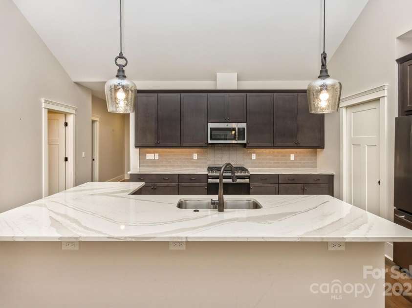 185 Sports Village Drive, Hendersonville, NC 28739.  MLS# CAR4247401, YatesRealty ID 9486. Open Quartz Counter Kitchen