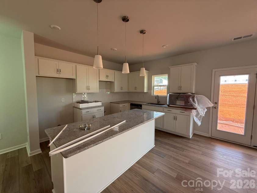 1227 Bansal Drive, Charlotte, NC 28215.  MLS# CAR4365795, YatesRealty ID 9487. Kitchen features White Cabinets and Granite countertops