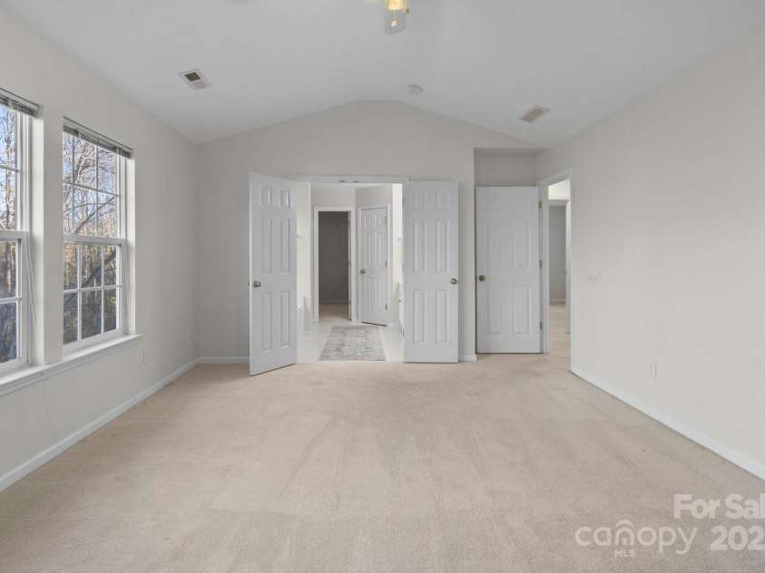 13443 Norseman Lane, Huntersville, NC 28078.  MLS# CAR4218329, YatesRealty ID 949. Primary Bedroom with entrance into Bathroom and Walk-in Closet