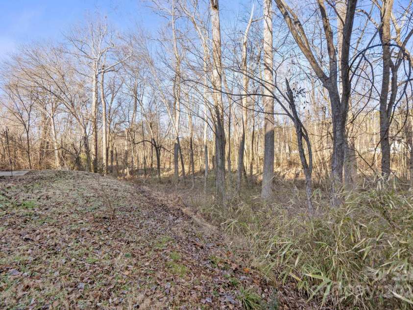 13443 Norseman Lane, Huntersville, NC 28078.  MLS# CAR4218329, YatesRealty ID 949. Think of the trees in full bloom providing your private backyard oasis