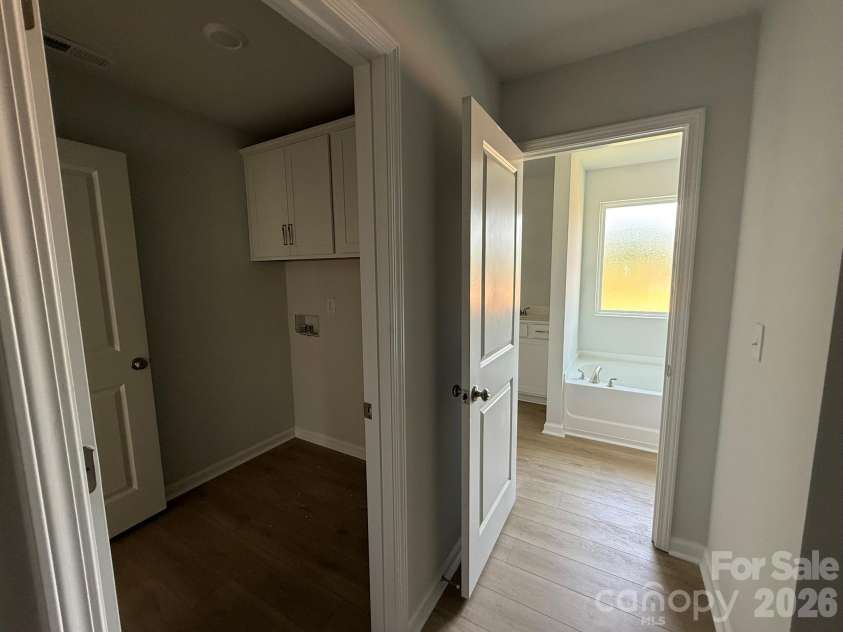 1305 Bansal Drive, Charlotte, NC 28215.  MLS# CAR4360795, YatesRealty ID 9492. Direct access to the Laundry Room through Primary Closet
