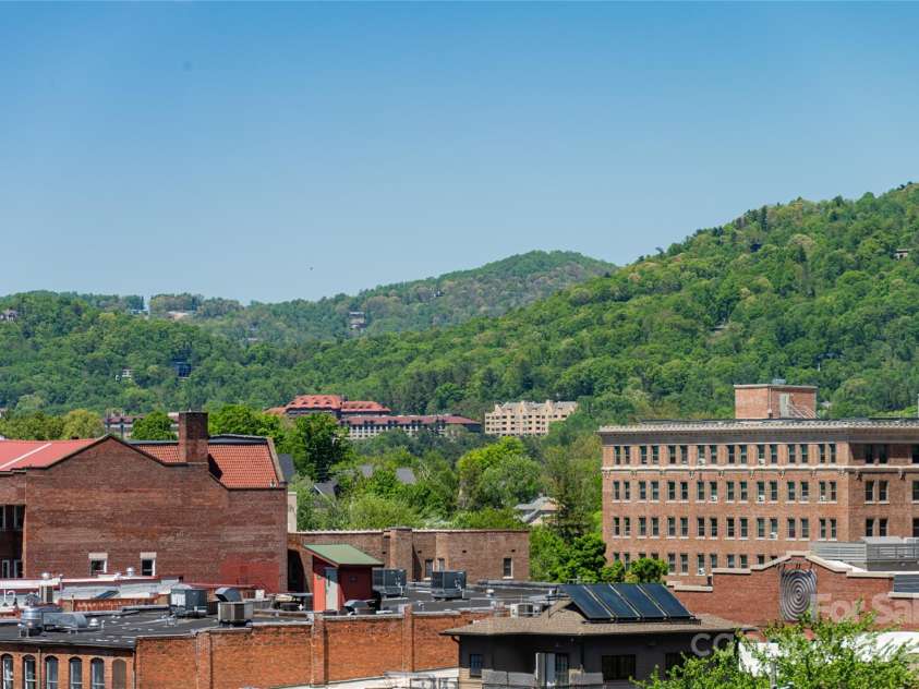 35 Patton Avenue, Asheville, NC 28801.  MLS# CAR4299187, YatesRealty ID 9493. Incredible views of Grove Park Inn and surrounding mountains from living room window of 402