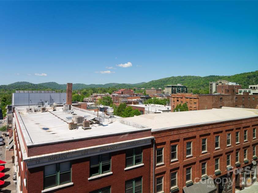 35 Patton Avenue, Asheville, NC 28801.  MLS# CAR4299187, YatesRealty ID 9493. Views of downtown skyline from LR window