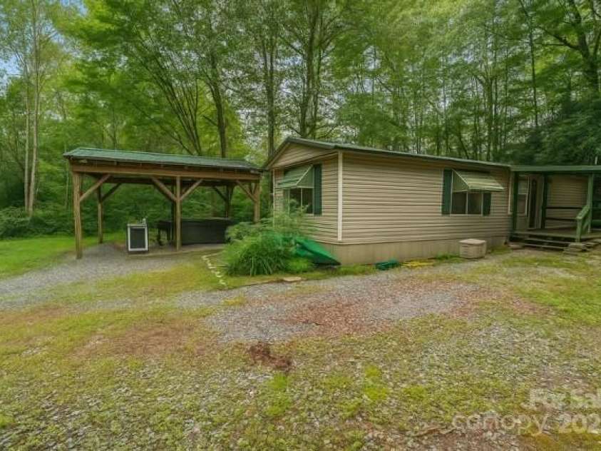 63 Apple Bee Road, Brevard, NC 28712.  MLS# CAR4271772, YatesRealty ID 95. Photo altered to remove exterior items from home