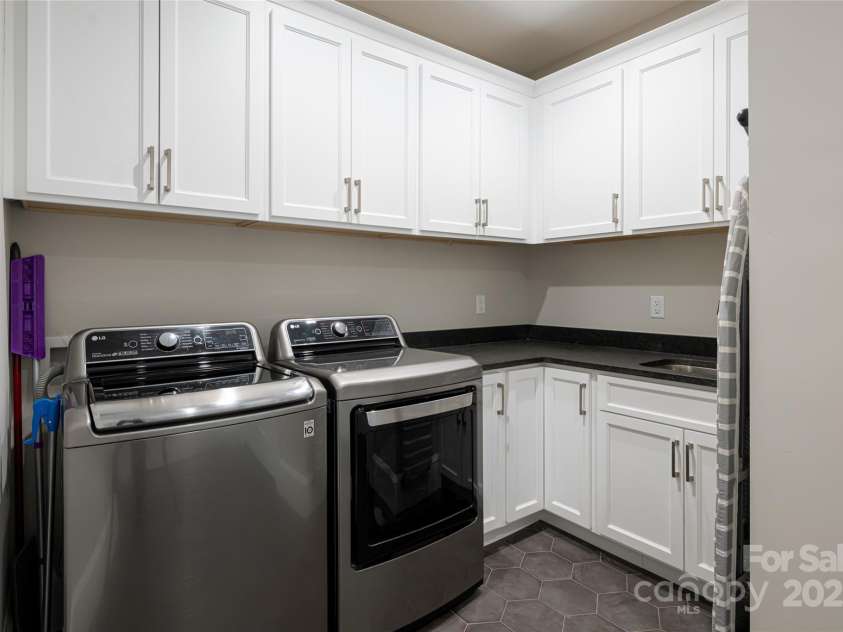 73 Starwood Valley Trail, Arden, NC 28704.  MLS# CAR4251821, YatesRealty ID 9502. Laundry room with plenty of storage LG washer/dryer convey