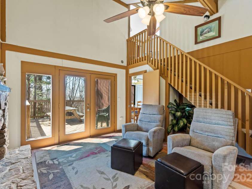 135 Clubhouse Road, Beech Mountain, NC 28604.  MLS# CAR4253056, YatesRealty ID 9507. Family room showing stairs to loft BR