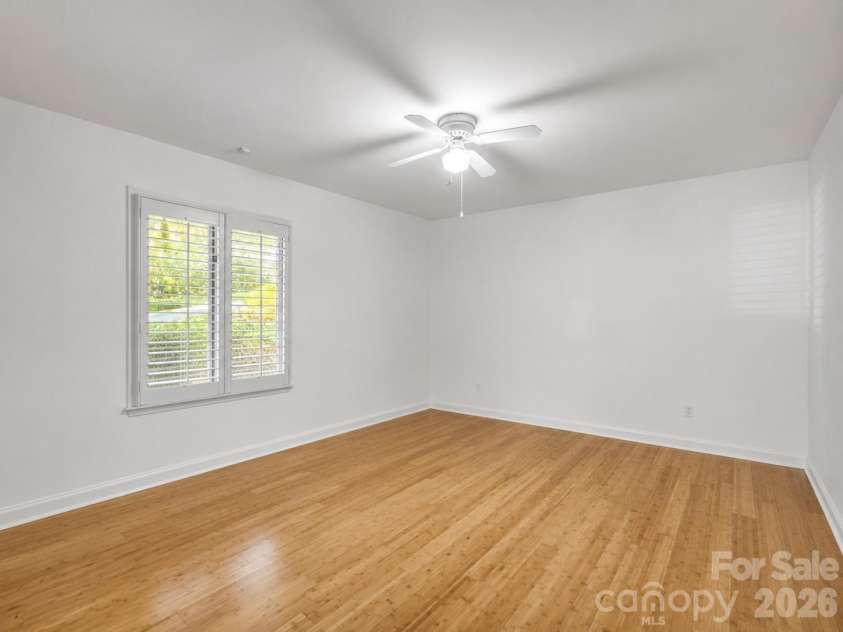 335 Melrose Avenue, Tryon, NC 28782.  MLS# CAR4417394, YatesRealty ID 9529. Bedroom #2 with plantation shutters