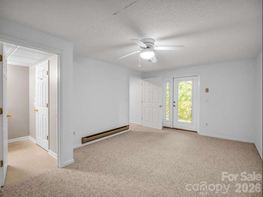 335 Melrose Avenue, Tryon, NC 28782.  MLS# CAR4417394, YatesRealty ID 9529. Double doors to patio. 2nd. lower bedroom or Office/recreation room