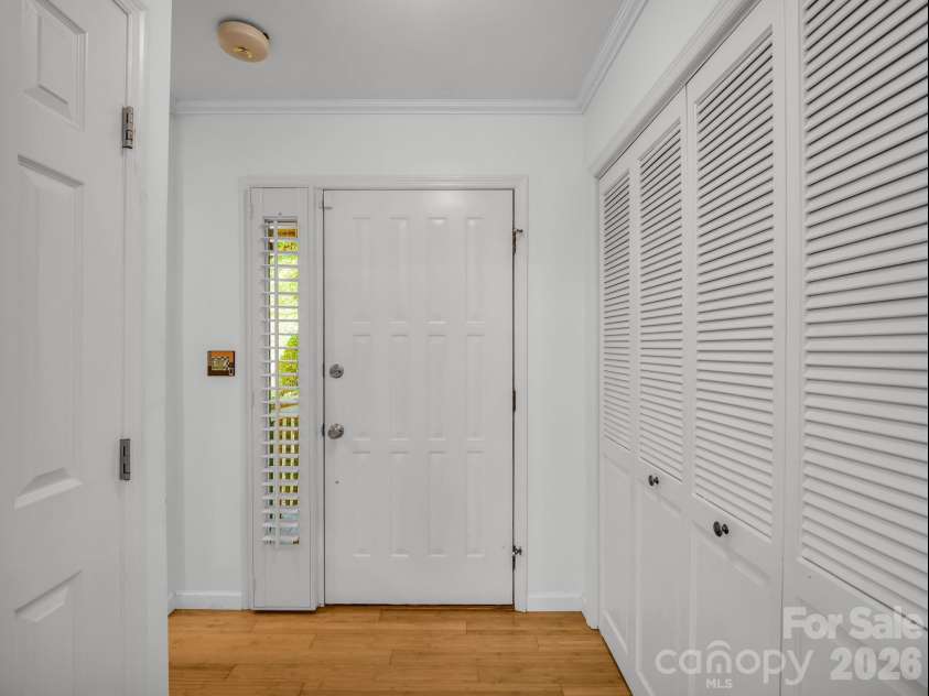 335 Melrose Avenue, Tryon, NC 28782.  MLS# CAR4417394, YatesRealty ID 9529. Foyer entrance with sidelight/coat closet & pantry with laundry