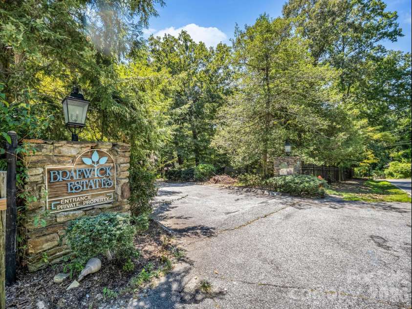 335 Melrose Avenue, Tryon, NC 28782.  MLS# CAR4417394, YatesRealty ID 9529. Front signage