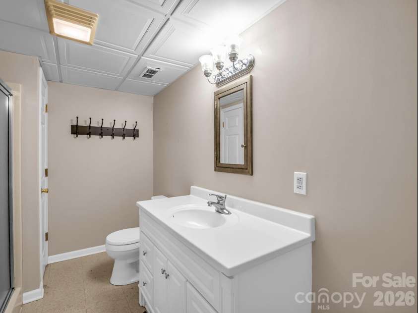 335 Melrose Avenue, Tryon, NC 28782.  MLS# CAR4417394, YatesRealty ID 9529. Full lower level Bath