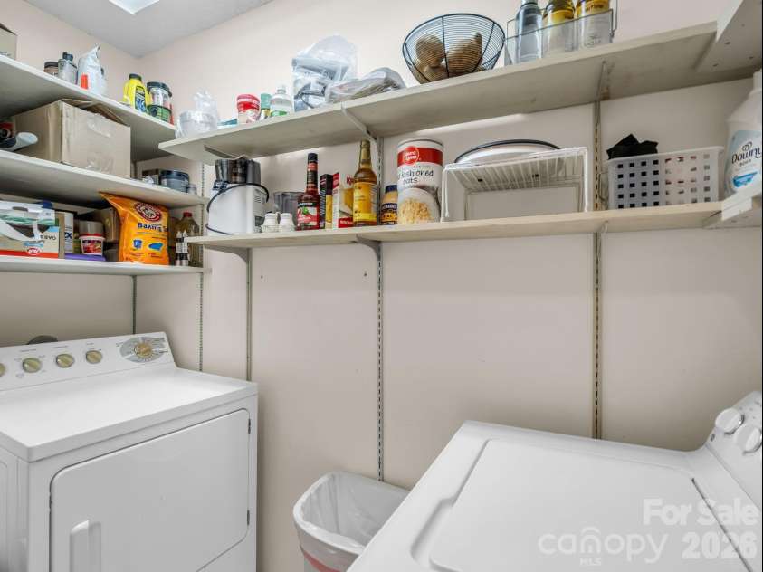 335 Melrose Avenue, Tryon, NC 28782.  MLS# CAR4417394, YatesRealty ID 9529. Laundry/Pantry behind louvred doors