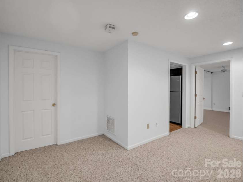 335 Melrose Avenue, Tryon, NC 28782.  MLS# CAR4417394, YatesRealty ID 9529. Living area with access to bath