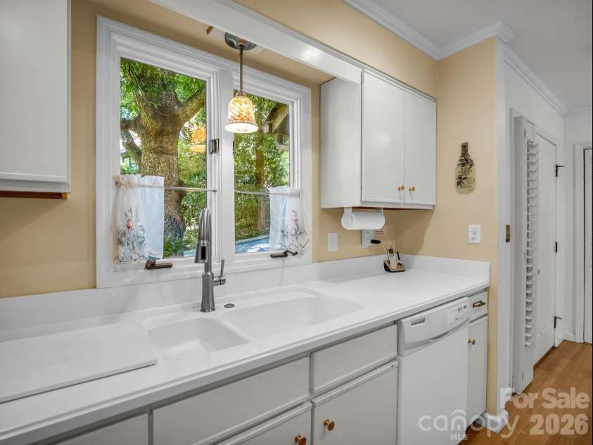 335 Melrose Avenue, Tryon, NC 28782.  MLS# CAR4417394, YatesRealty ID 9529. Lovely to have a window over double sink